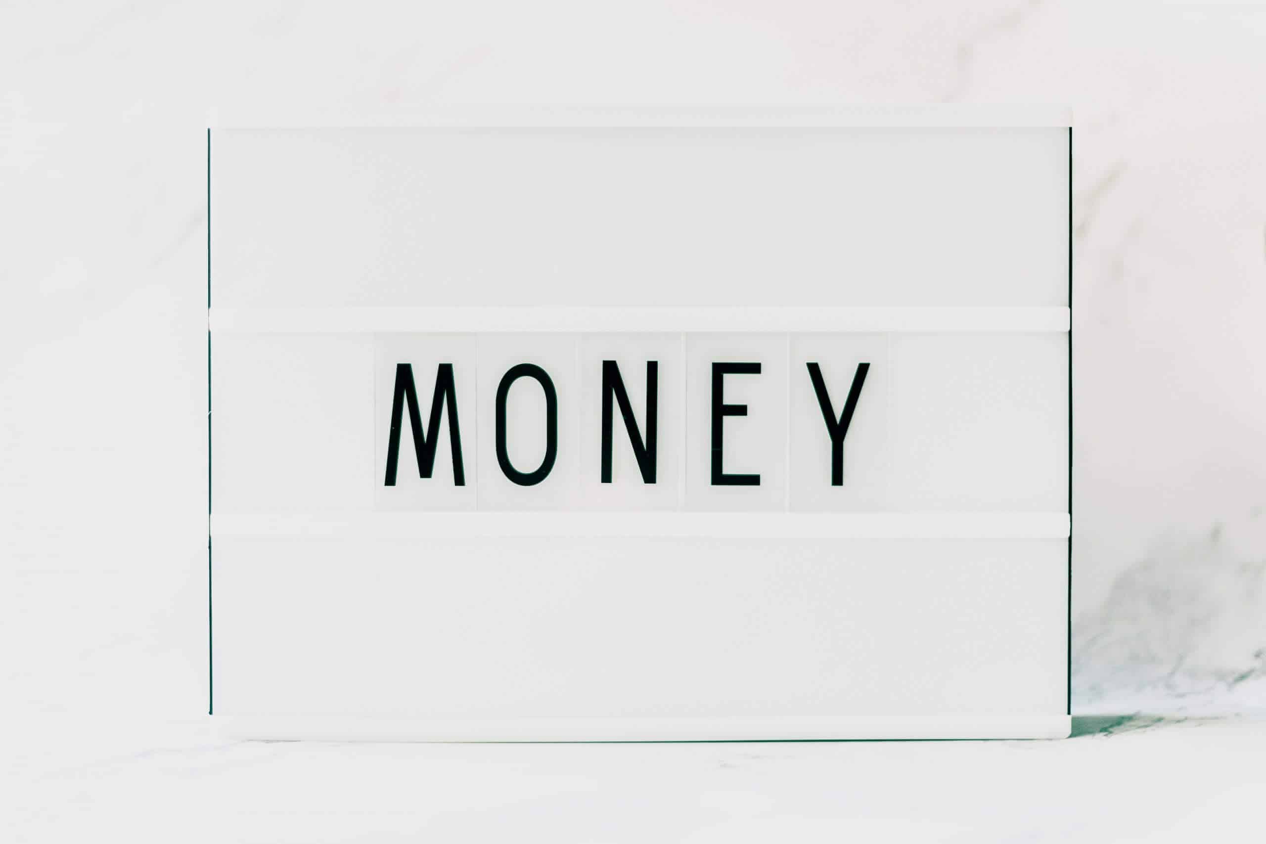 Photo of a lightbox with the word Money placed over it.